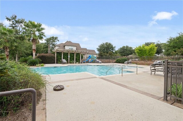 view of pool featuring a pergola and a patio