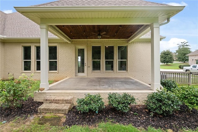 rear view of property with a patio and ceiling fan