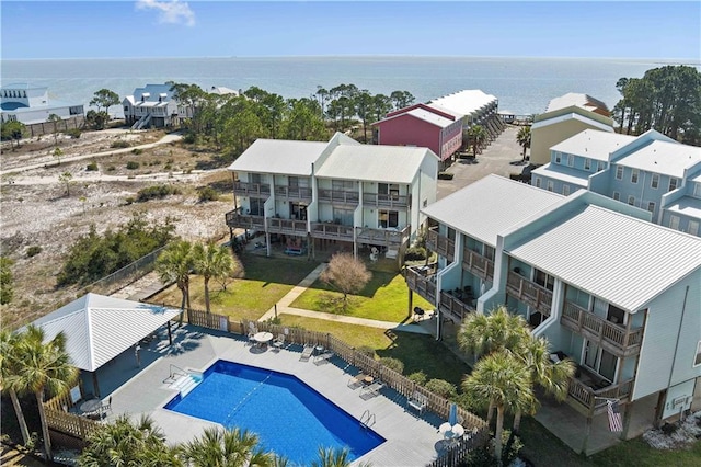 birds eye view of property with a water view