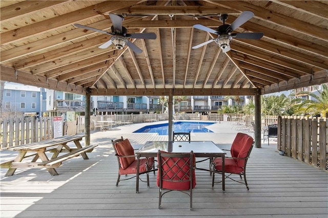 deck with ceiling fan and a community pool