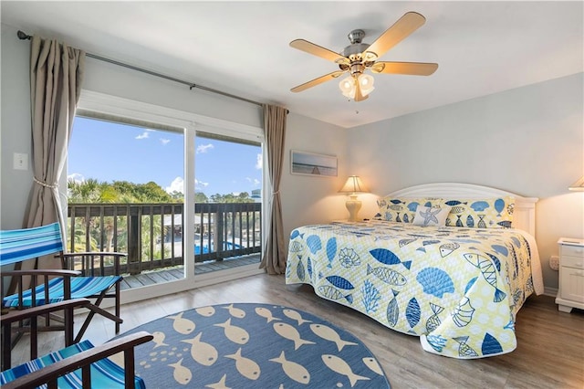 bedroom featuring hardwood / wood-style floors, access to outside, and ceiling fan