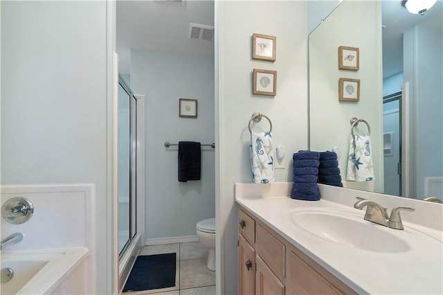 full bathroom with vanity, tile patterned flooring, toilet, and plus walk in shower