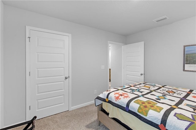 bedroom featuring light colored carpet