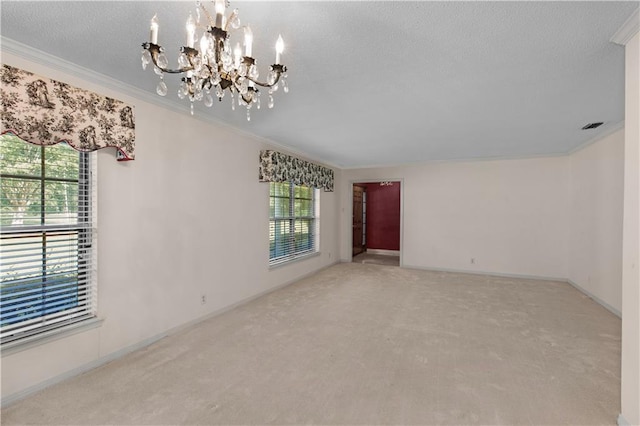 720 Grand Bay-Wilmer Rd N, Mobile, AL 36608 - unfurnished room with a chandelier, ornamental molding, carpet, and a textured ceiling