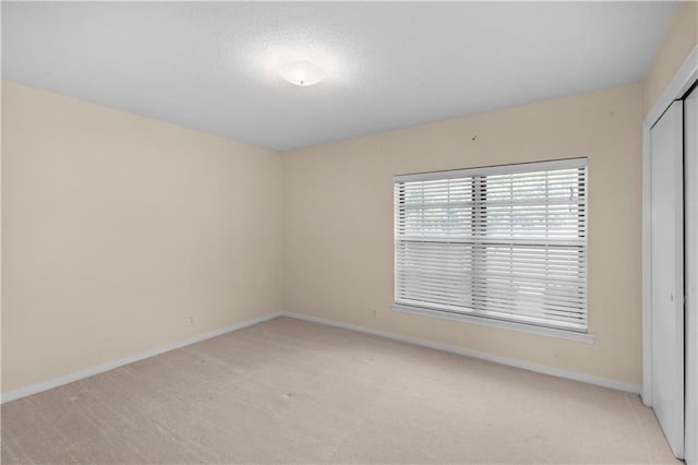 720 Grand Bay-Wilmer Rd N, Mobile, AL 36608 - spare room with light carpet, baseboards, and a textured ceiling