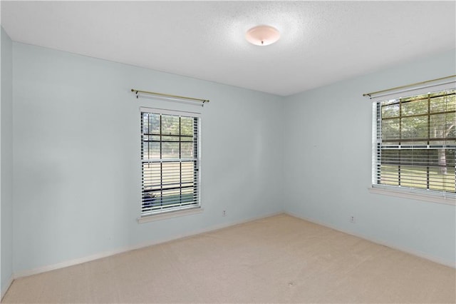 720 Grand Bay-Wilmer Rd N, Mobile, AL 36608 - empty room with carpet flooring, baseboards, and a textured ceiling