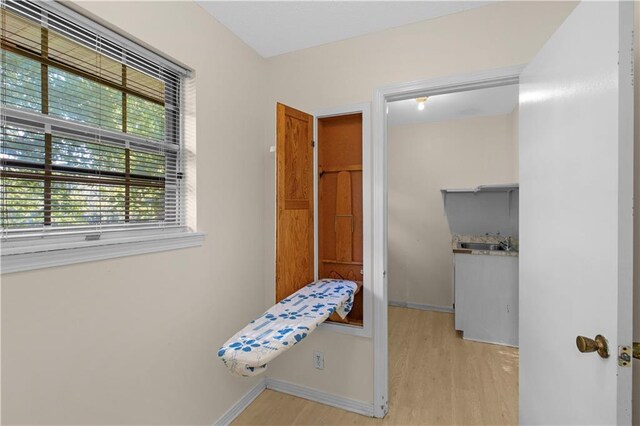 720 Grand Bay-Wilmer Rd N, Mobile, AL 36608 - bedroom featuring light wood-type flooring and baseboards