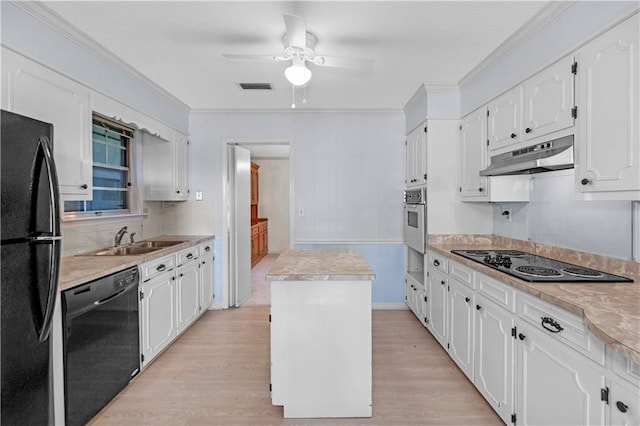 720 Grand Bay-Wilmer Rd N, Mobile, AL 36608 - kitchen featuring black appliances, under cabinet range hood, a sink, light wood-style floors, and ornamental molding