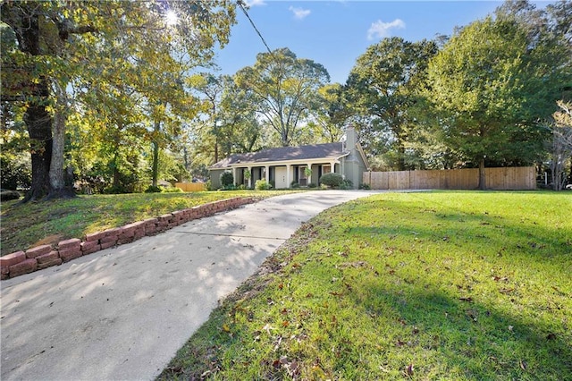 ranch-style home with a front lawn