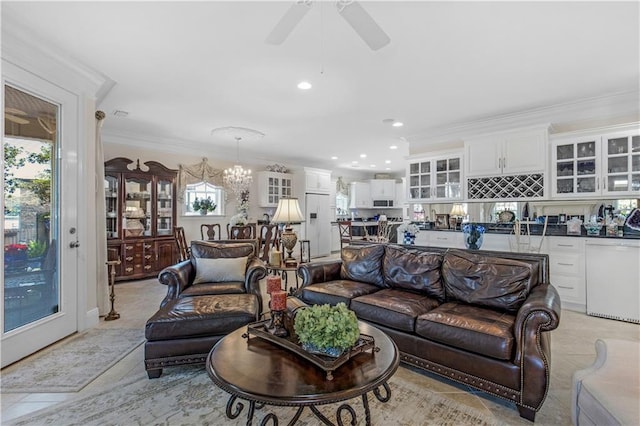 living room featuring ceiling fan with notable chandelier, light tile patterned floors, crown molding, and recessed lighting