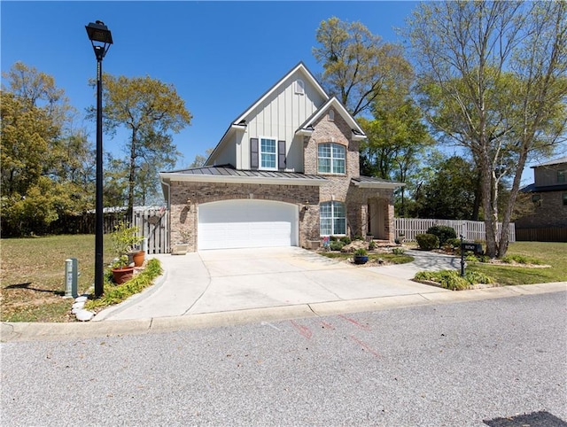 view of front of property featuring a standing seam roof, concrete driveway, fence, board and batten siding, and metal roof
