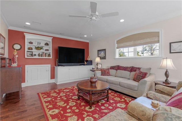 living area with recessed lighting, wood finished floors, ceiling fan, and ornamental molding