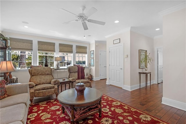 living room with dark wood-style flooring, ornamental molding, and a healthy amount of sunlight