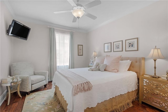 bedroom with crown molding, ceiling fan, and wood finished floors