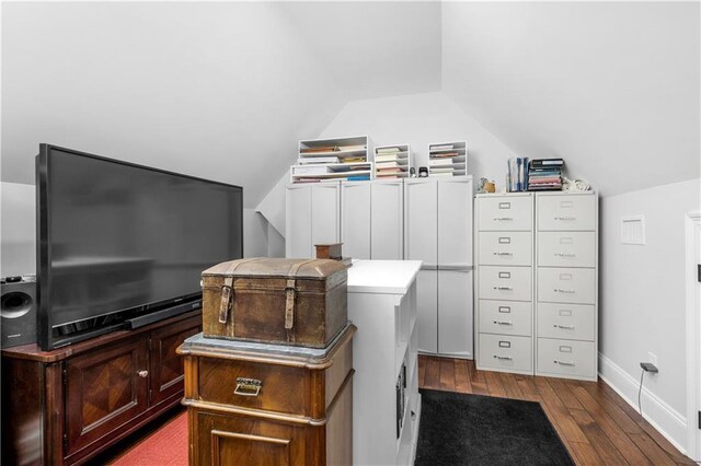 interior space with baseboards and dark wood finished floors