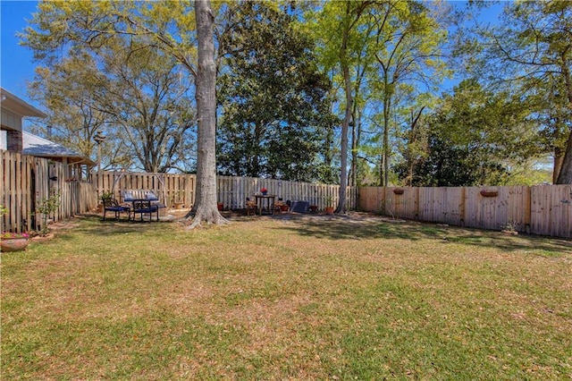 view of yard with a fenced backyard