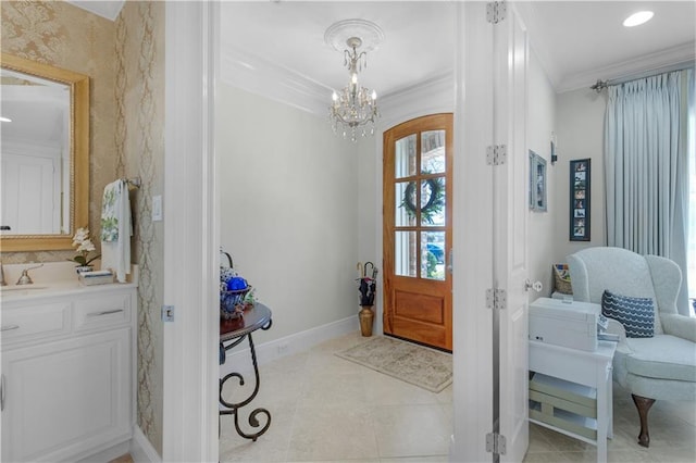 foyer entrance with crown molding, recessed lighting, baseboards, light tile patterned flooring, and a notable chandelier