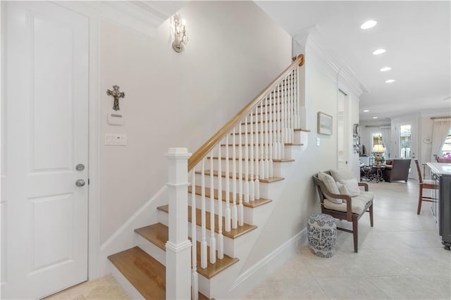stairway with baseboards, tile patterned floors, and recessed lighting