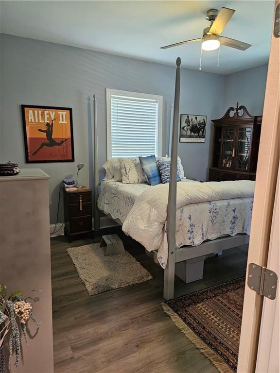 bedroom with wood finished floors and ceiling fan