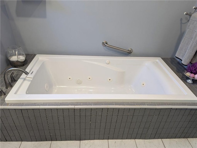 full bathroom with a whirlpool tub