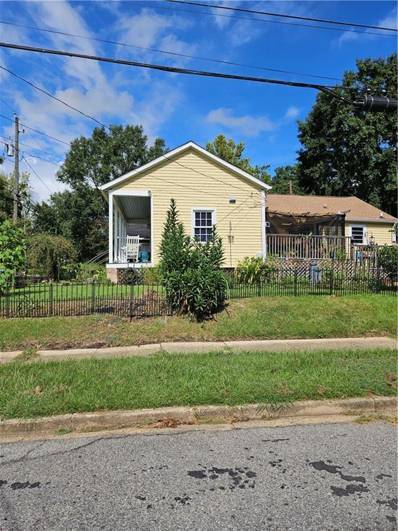 view of property exterior featuring a fenced front yard