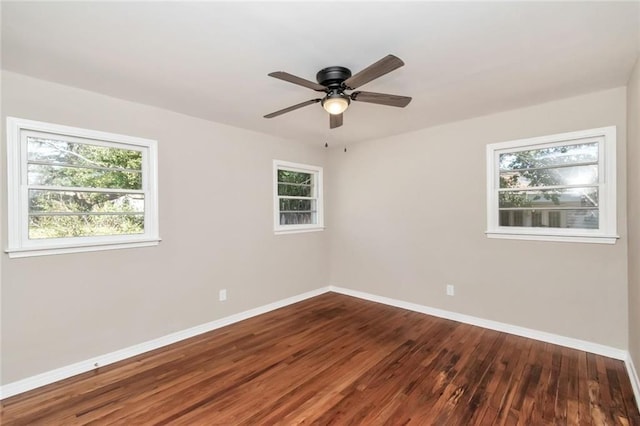 unfurnished room with ceiling fan, baseboards, and wood finished floors