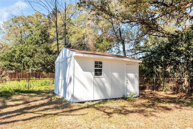 view of shed with a fenced backyard