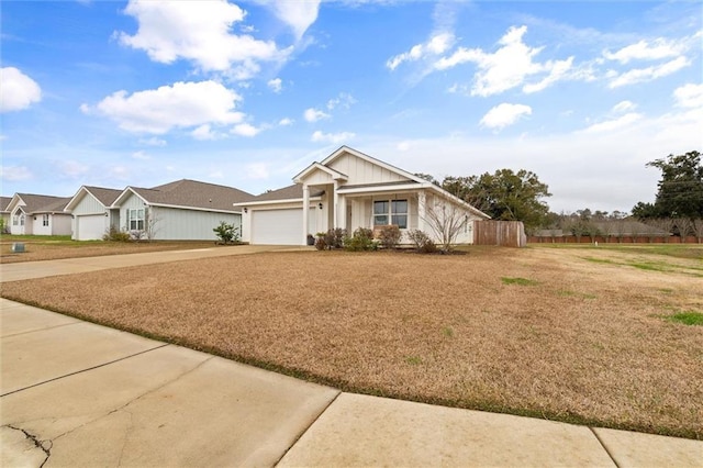 view of front of home featuring a front lawn and a garage