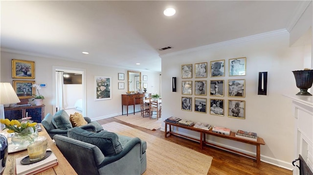 living room with wood-type flooring and ornamental molding