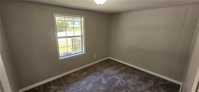 carpeted spare room featuring a healthy amount of sunlight