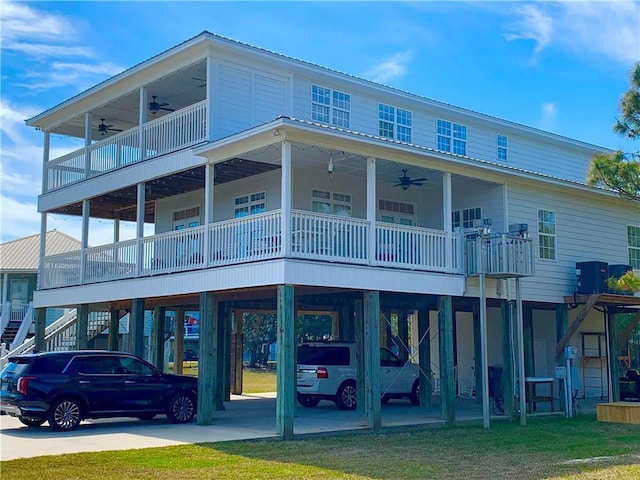 exterior space featuring stairs, a carport, and driveway