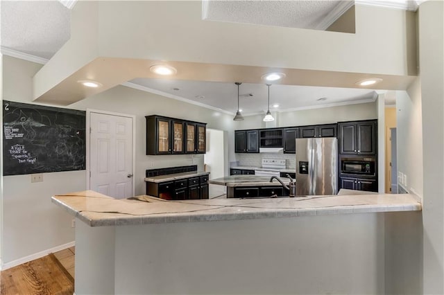 kitchen with stainless steel fridge, ornamental molding, light wood-style floors, black microwave, and backsplash