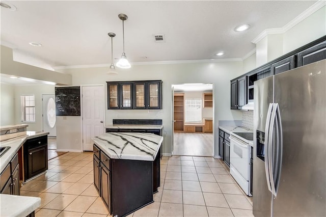 kitchen with visible vents, stainless steel fridge, electric range, and light tile patterned floors