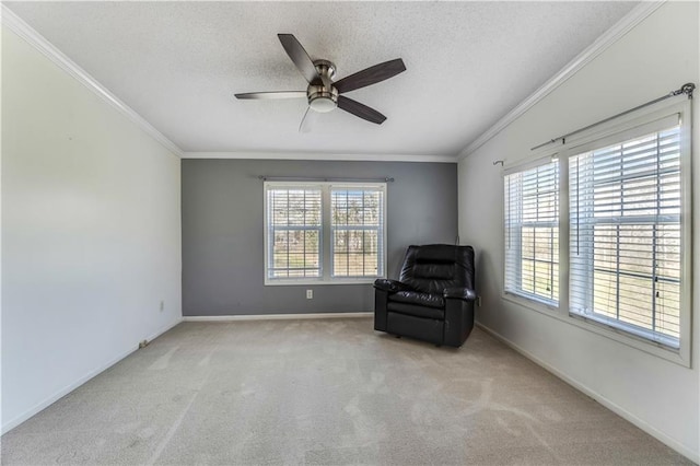 unfurnished room with baseboards, a ceiling fan, ornamental molding, a textured ceiling, and carpet floors