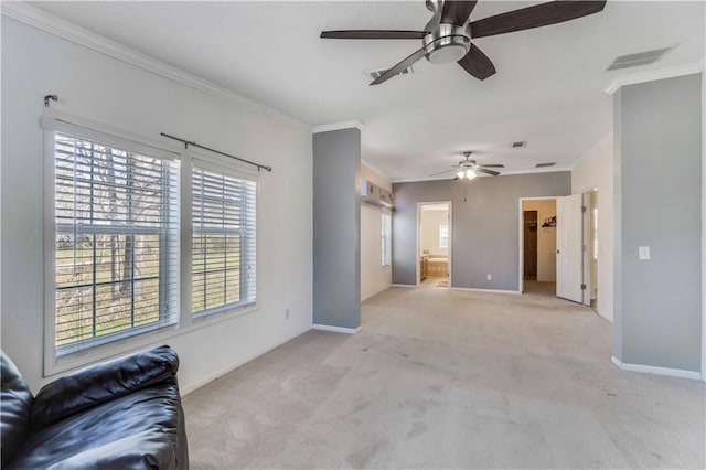 unfurnished living room featuring ornamental molding, light colored carpet, visible vents, and baseboards