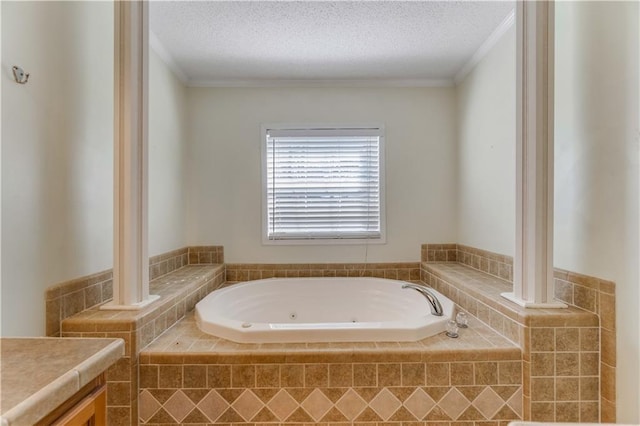 full bathroom featuring a textured ceiling, a tub with jets, and crown molding