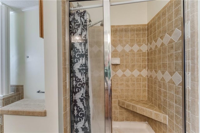 bathroom with a stall shower and crown molding