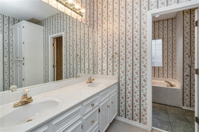 bathroom with a bathing tub, tile patterned floors, and vanity