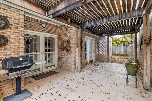 view of patio / terrace with french doors, area for grilling, and a pergola