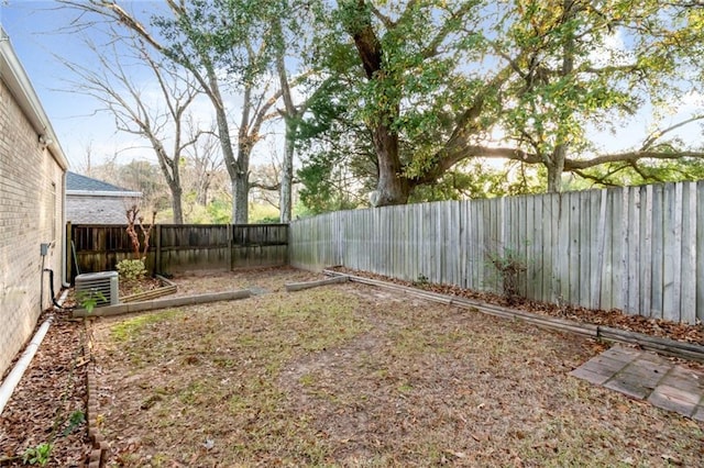 view of yard with central AC