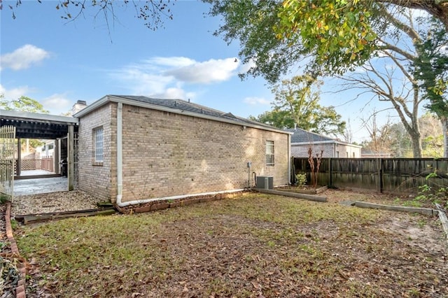 view of home's exterior with central AC