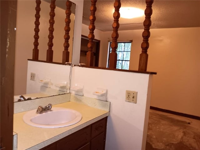 609 Gehrig Ave, Prichard, AL 36610 - bathroom with vanity and a textured ceiling