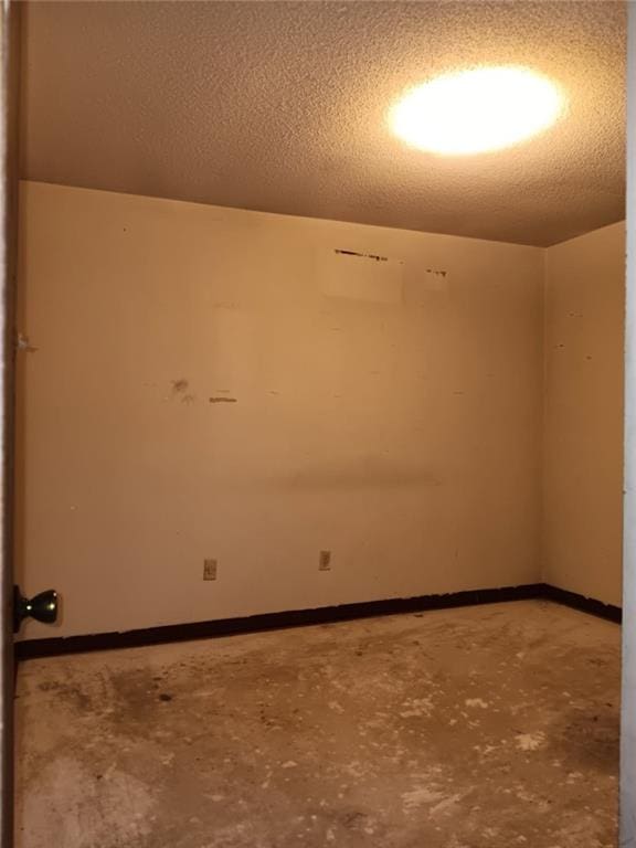 609 Gehrig Ave, Prichard, AL 36610 - unfurnished room with unfinished concrete floors and a textured ceiling