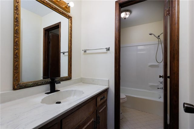 full bathroom featuring toilet, shower / washtub combination, vanity, and tile patterned floors