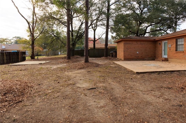 view of yard with a patio area and fence