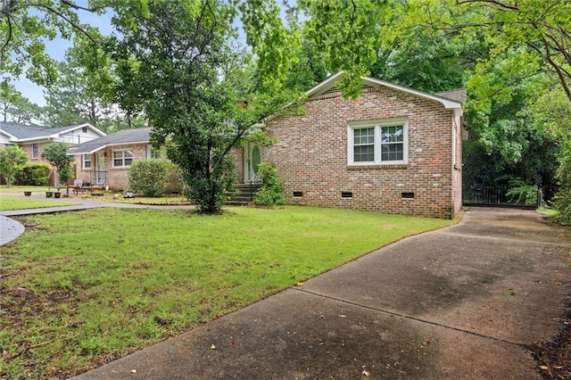 409 Byron Ave E, Mobile, AL 36609 - view of front of house with crawl space, brick siding, a front lawn, and concrete driveway