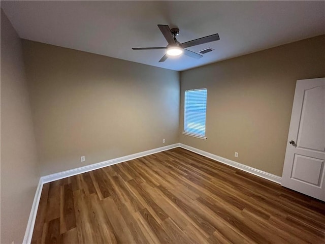 unfurnished room featuring ceiling fan and hardwood / wood-style flooring