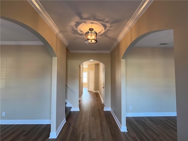 hallway featuring dark wood-type flooring and ornamental molding