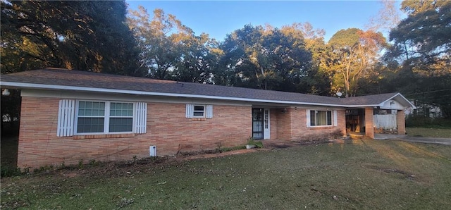 ranch-style home with a front yard