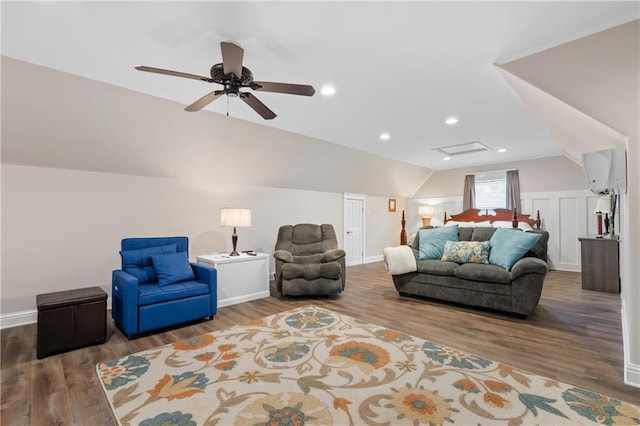 living room featuring vaulted ceiling, ceiling fan, and hardwood / wood-style flooring